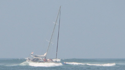 Lotus aground in the surf Bahia del Sol, El Salvador