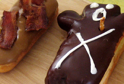 voodoo doughnuts portrait of a bacon maple bar and a blood filled voodoo donut