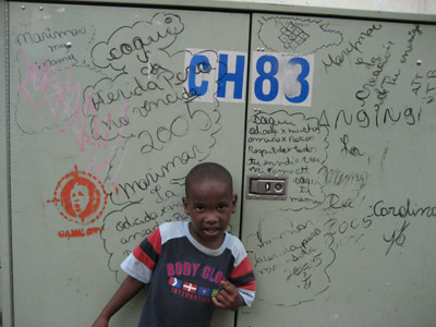 Anti-bush graffiti. Street kid. Panama City