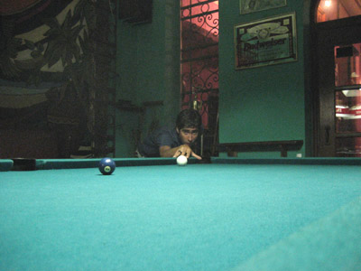 Cousing tito playing pool at El Pavo Real, Panama City