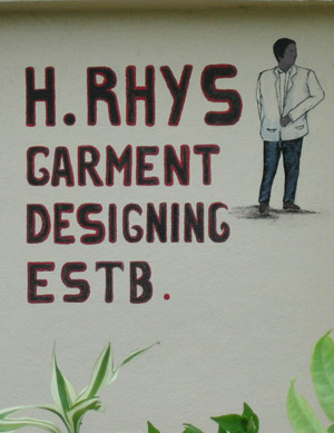 Hand Painted Sign. H. Rhys Garment designing estb. Dangriga Town, Belize