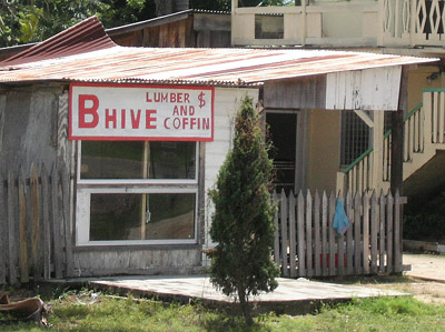 Hand Painted Sign. Bhive $ Lumber and coffin. Dangriga Town, Belize