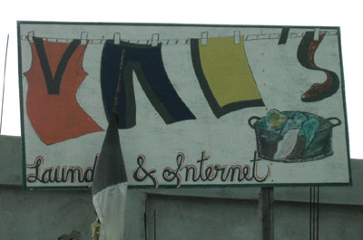 Hand Painted Sign. Vals laundry and internet. Dangriga Town, Belize