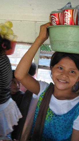 young girl vendor on the bus. El Salvador